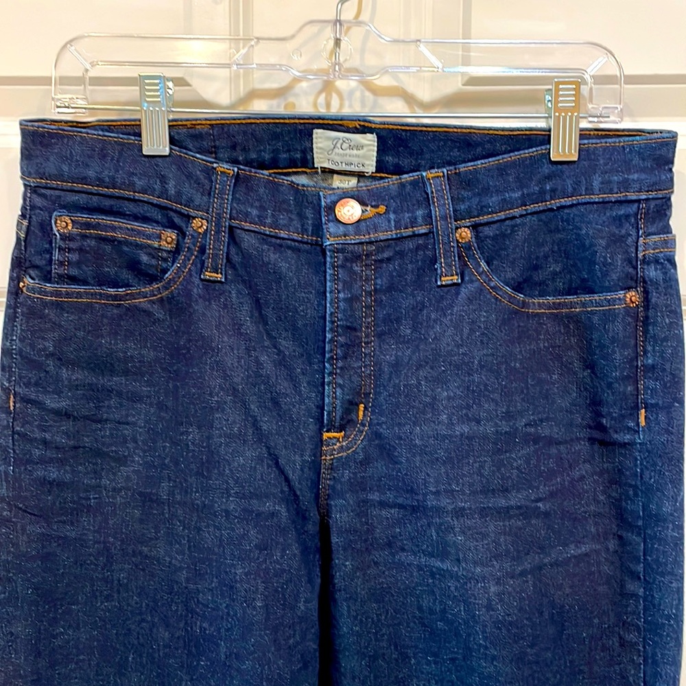 J Crew toothpick dark wash jeans.
